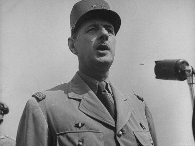 skadding-george-french-gen-charles-de-gaulle-speaking-into-mike-during-his-visit-with-us-officials.jpg